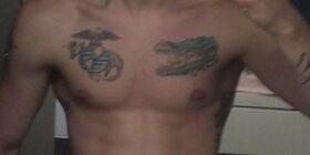 is the tattoo on the right an alligator