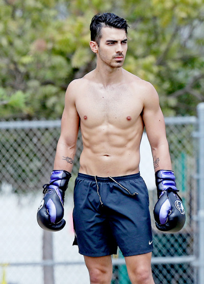 joe jonas showing off his insane body while going