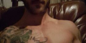 hung tatted guy fucks sofa cums