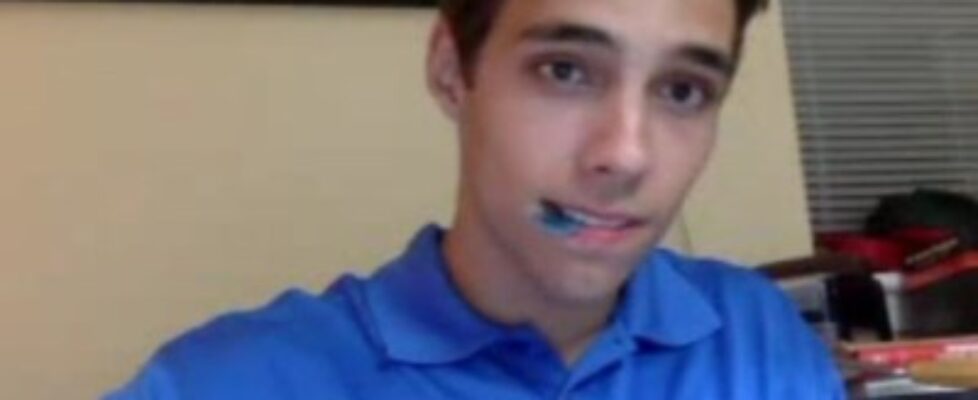 cute guy is playing his guitar in a blue polo a