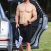 chris hemsworth changing out of swimtrunks in only