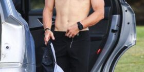 chris hemsworth changing out of swimtrunks in only